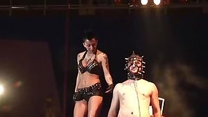 extreme fetish show on public show stage