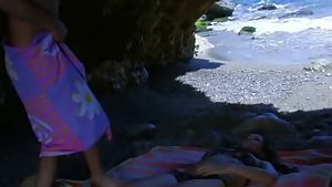 Brunette beauty craves hard cock at the beach