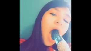 Cute teen girl practicing blowjobs